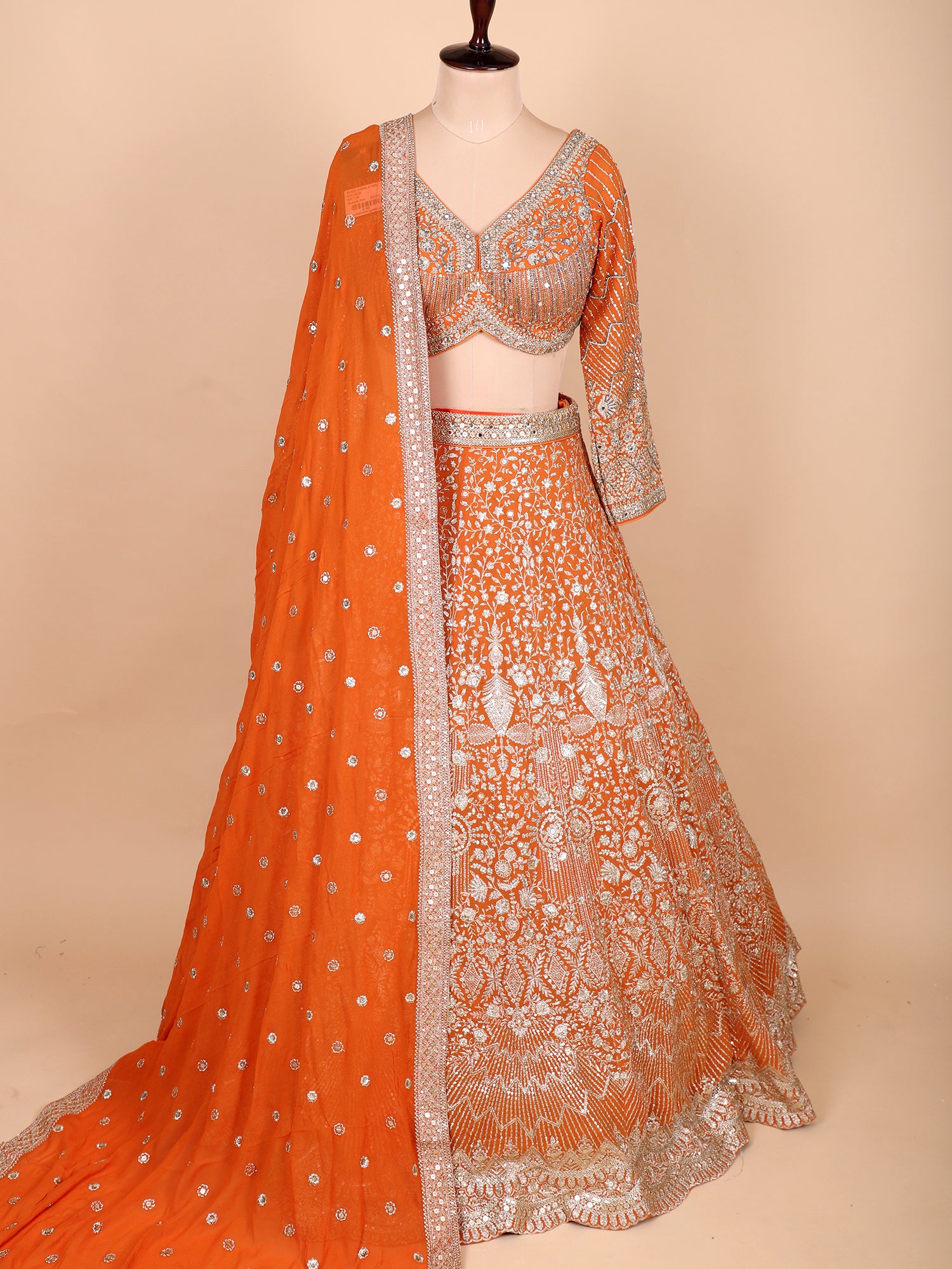 Elegant Orange Lehenga Set With Rich Embroidery And Sequins