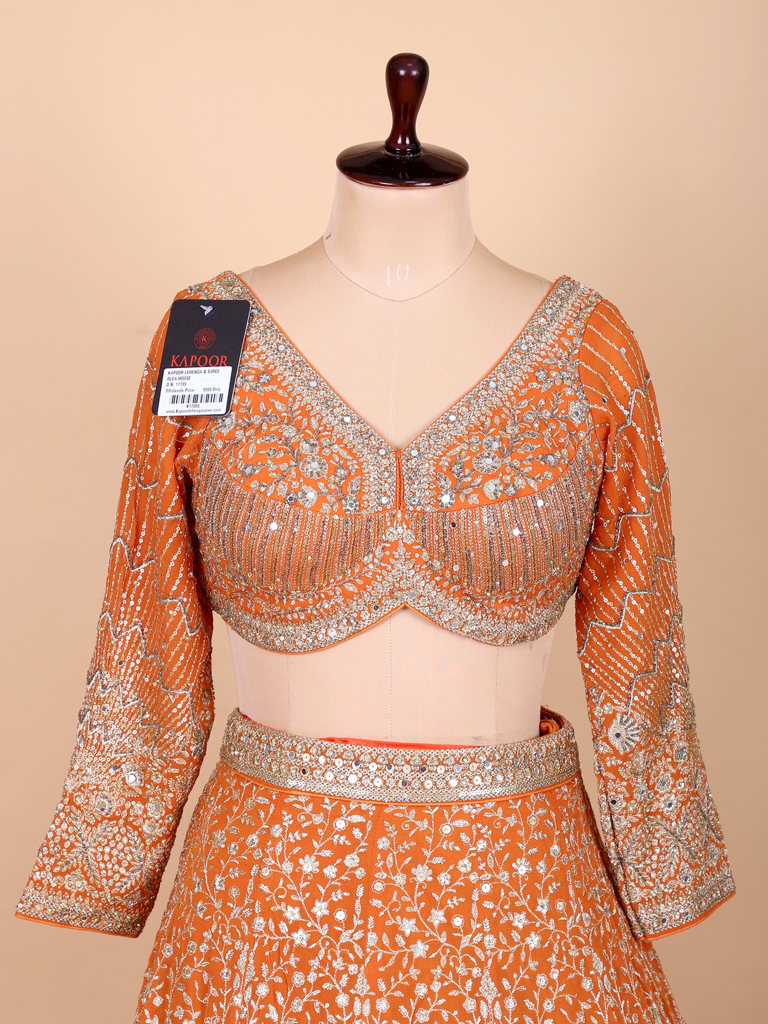 Elegant Orange Lehenga Set With Rich Embroidery And Sequins