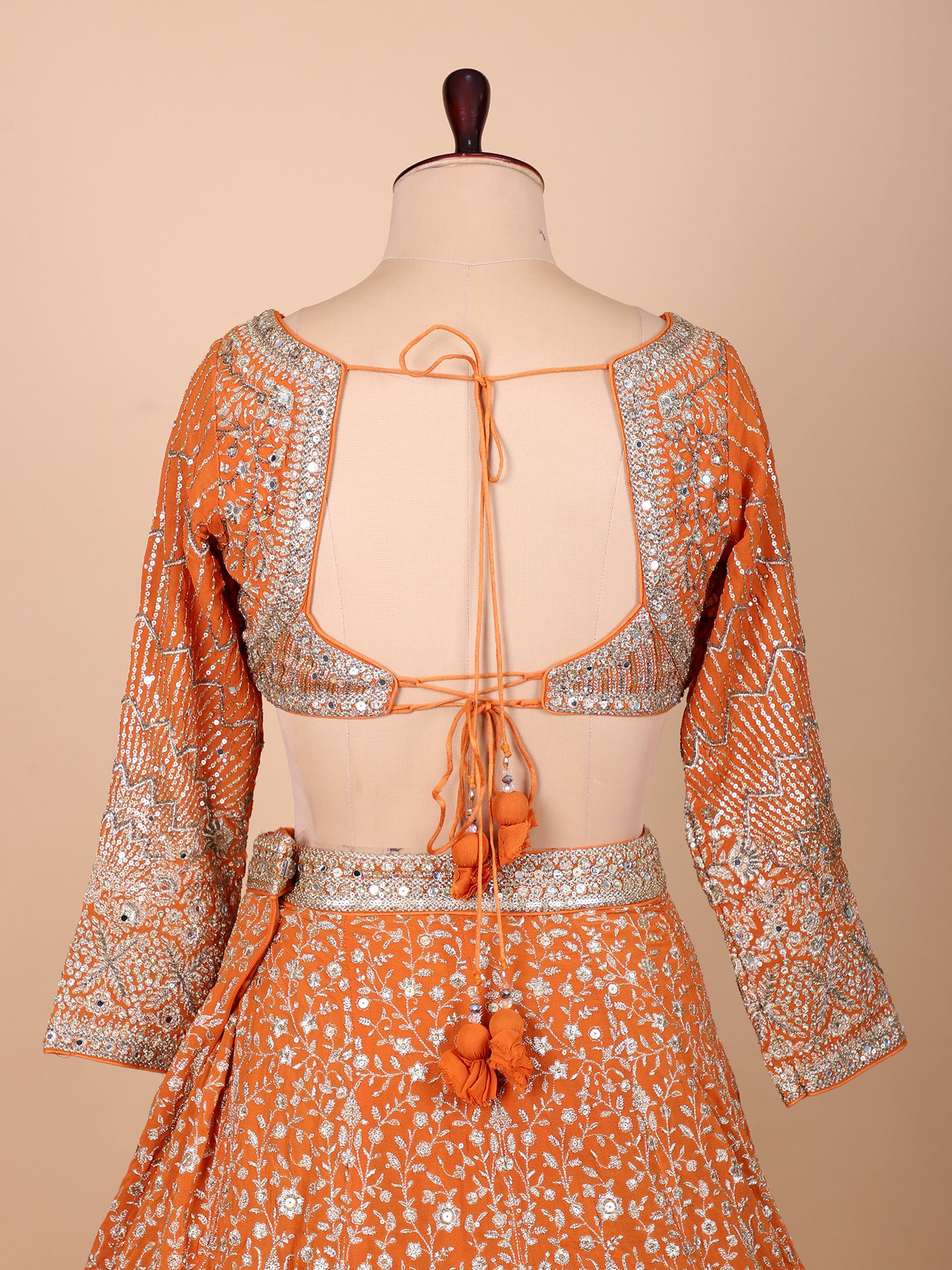 Elegant Orange Lehenga Set With Rich Embroidery And Sequins