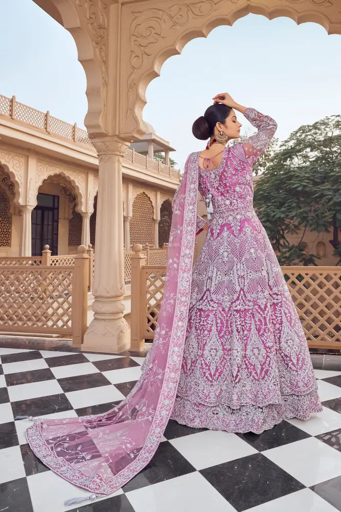 Eye-Catching Pink Net Saree With Sequins And Thread Detailing Saree