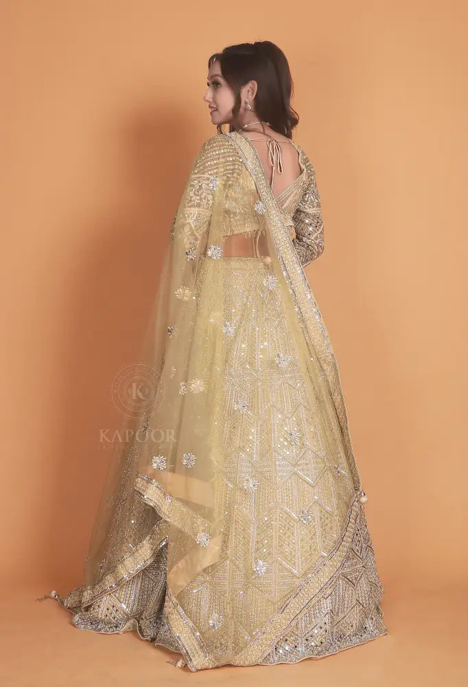 Golden Net Lehenga With Stone Work And Hand-Touch Detailing