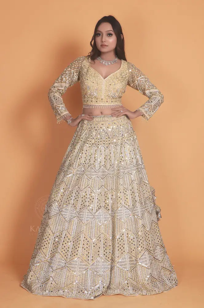 Golden Net Lehenga With Stone Work And Hand-Touch Detailing