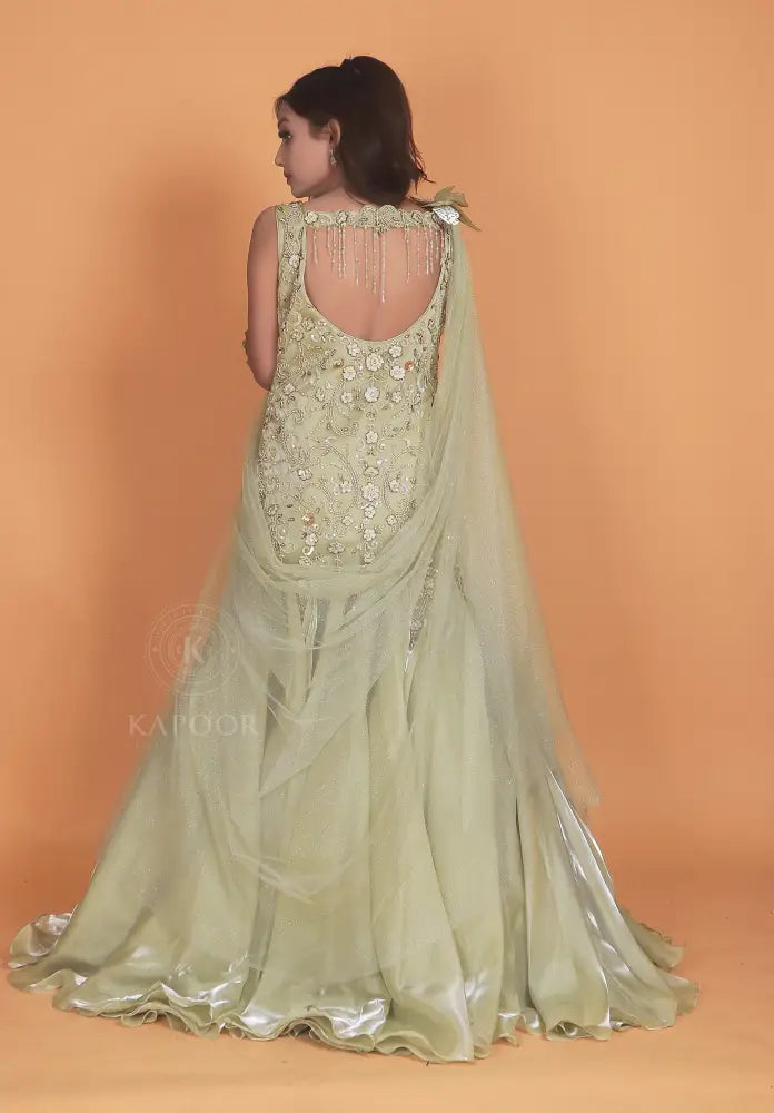 Opulent Pista Green Gown With Jimmy Choo Fabric And Stone Embellishments