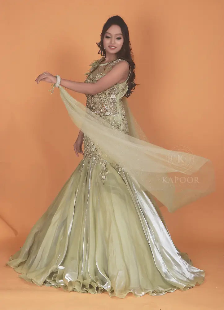 Opulent Pista Green Gown With Jimmy Choo Fabric And Stone Embellishments