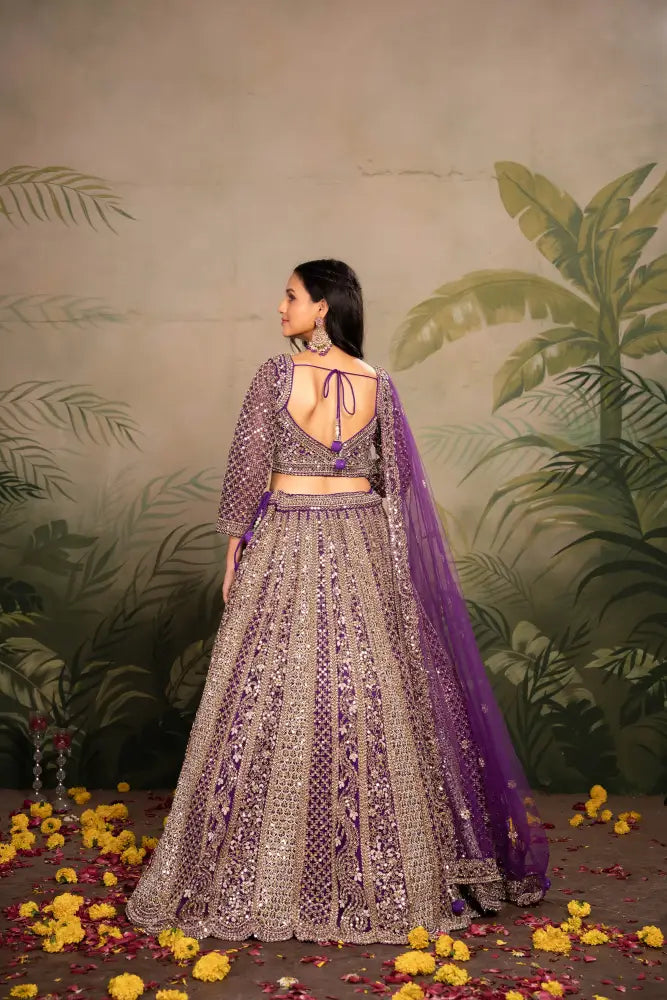 Purple Net Lehenga With Dupatta Featuring Intricate Mirror Jarkan Lehenga