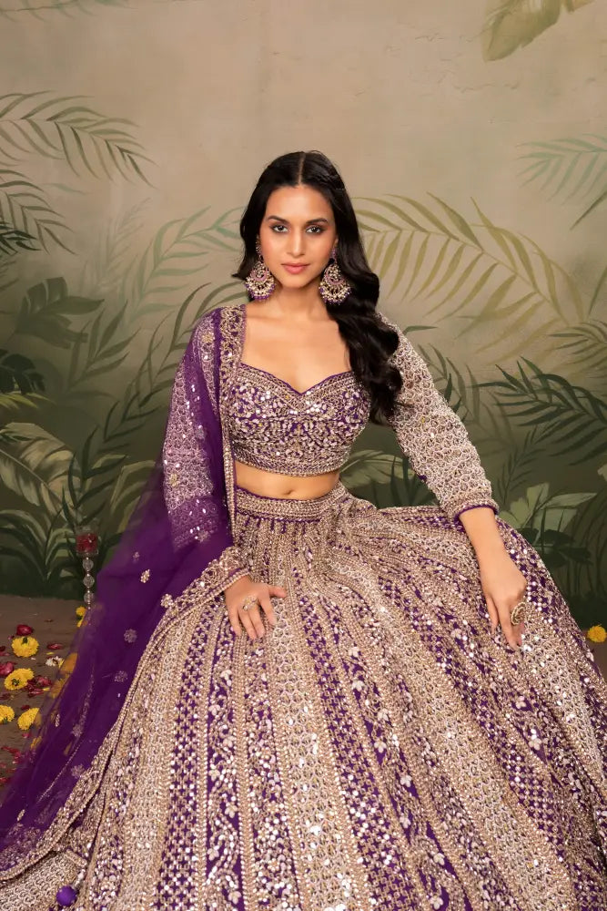 Purple Net Lehenga With Dupatta Featuring Intricate Mirror Jarkan Lehenga