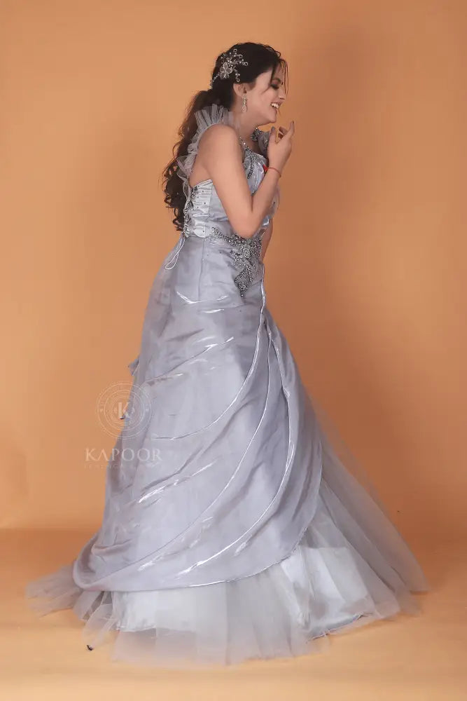 Silver Designer Gown With Handwork And Stone Detailing In Net Fabric