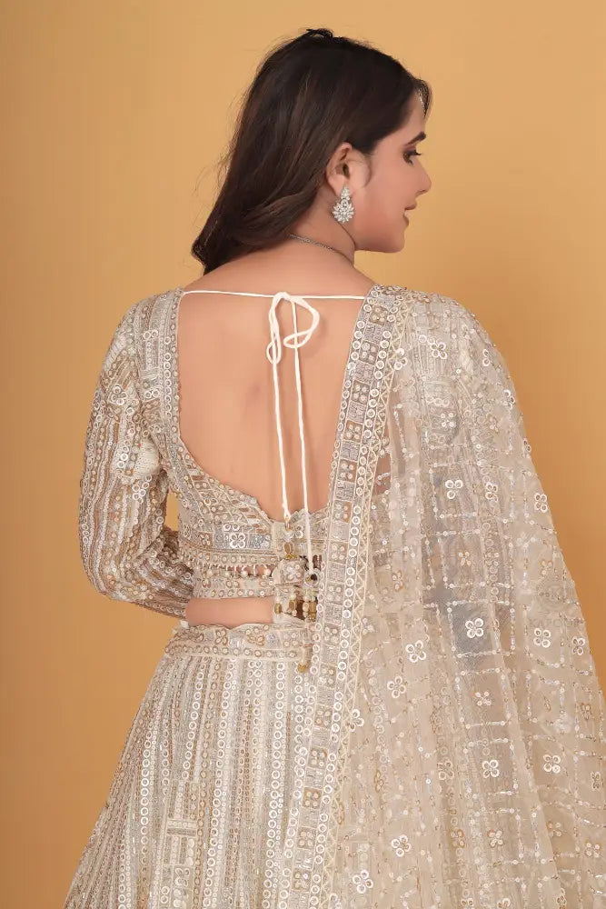 White Bollywood Inspired Net Lehenga With Hand-Pal Work Sequence And Jarkan Details