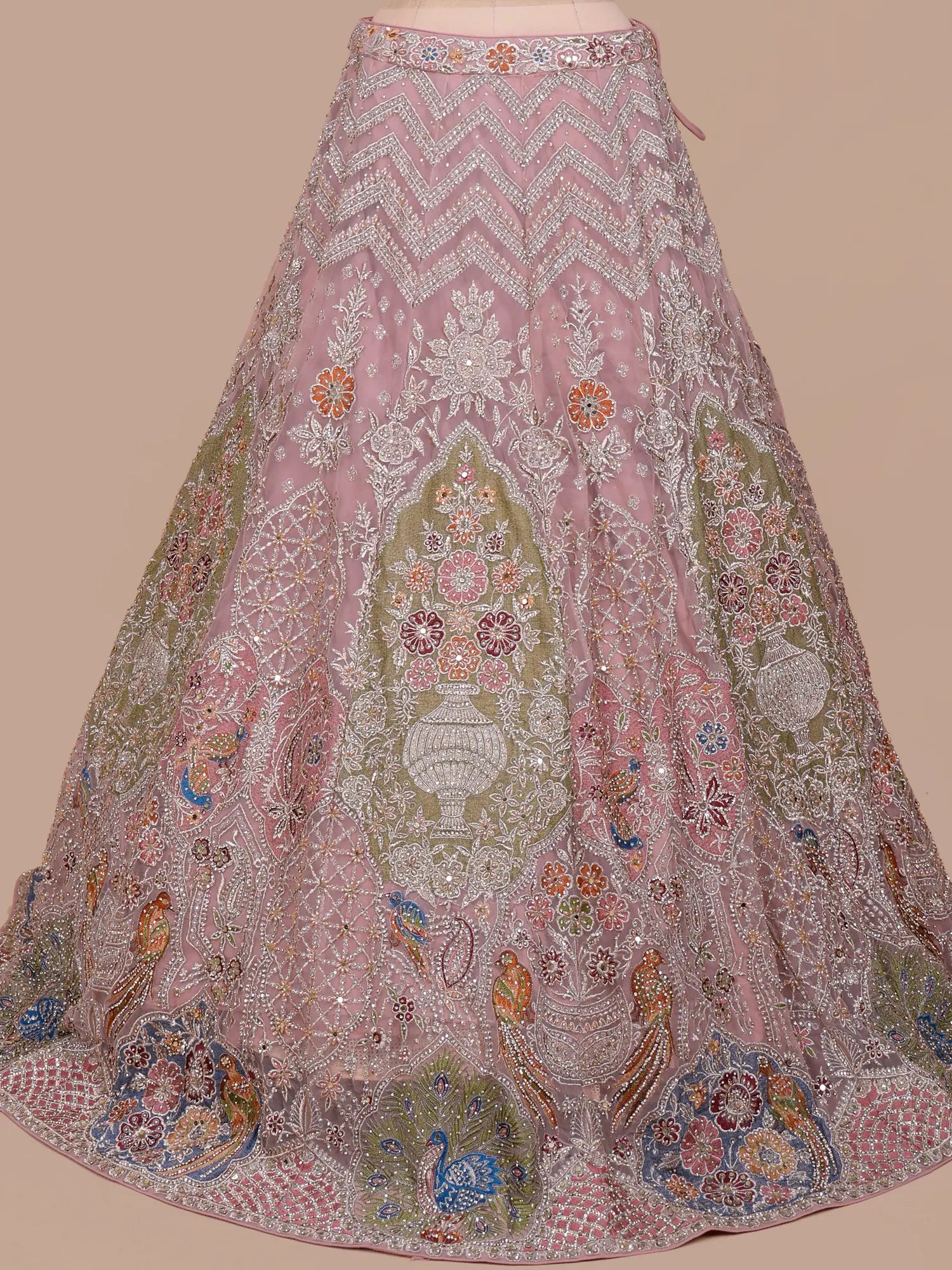 Discover Onion Pink Premium Lehenga Showcasing Artistic Bridal Figure Embroidery
