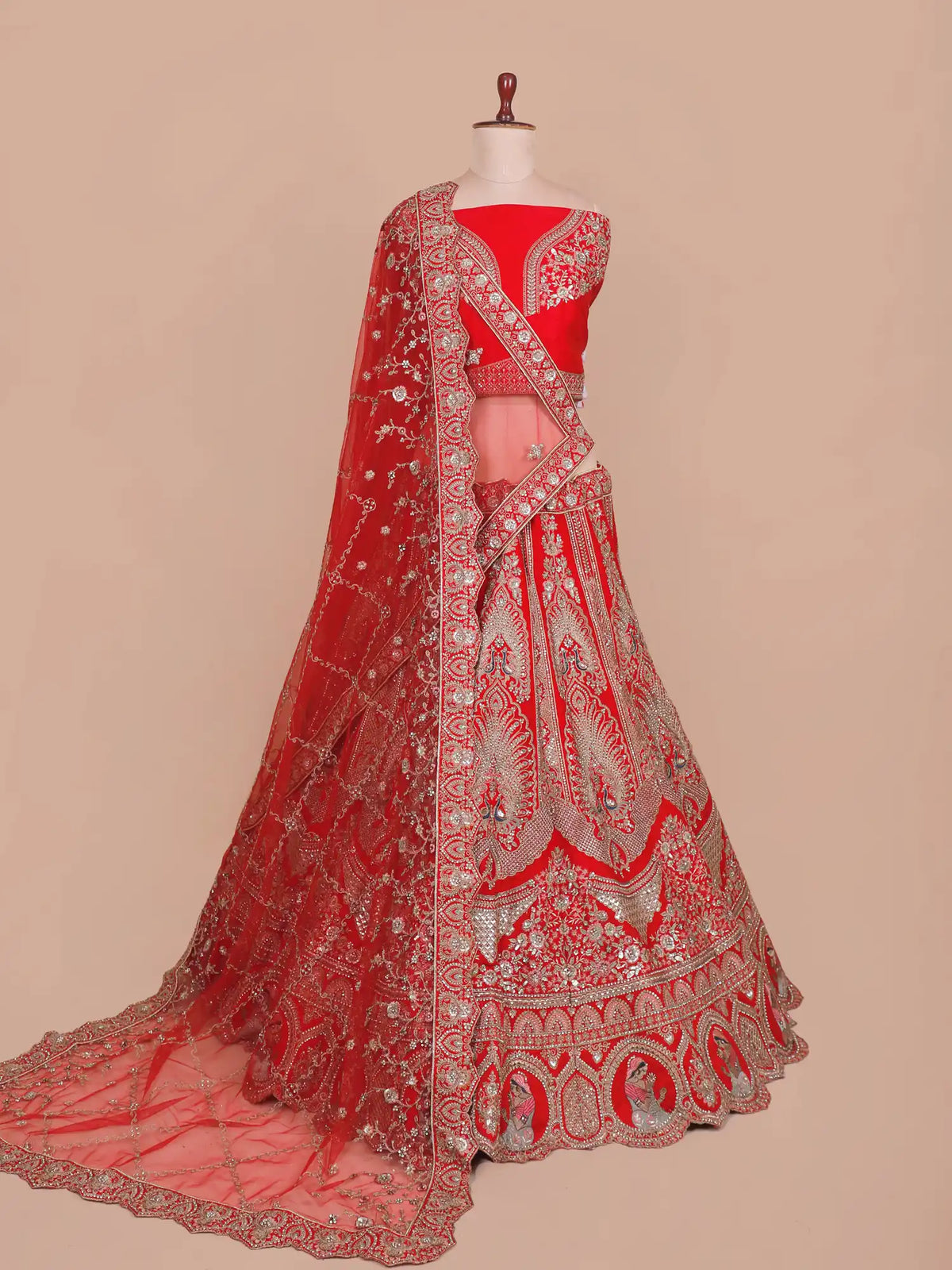 Regal Silk Bridal Lehenga with Blue Peacock and Portrait Embroidery
