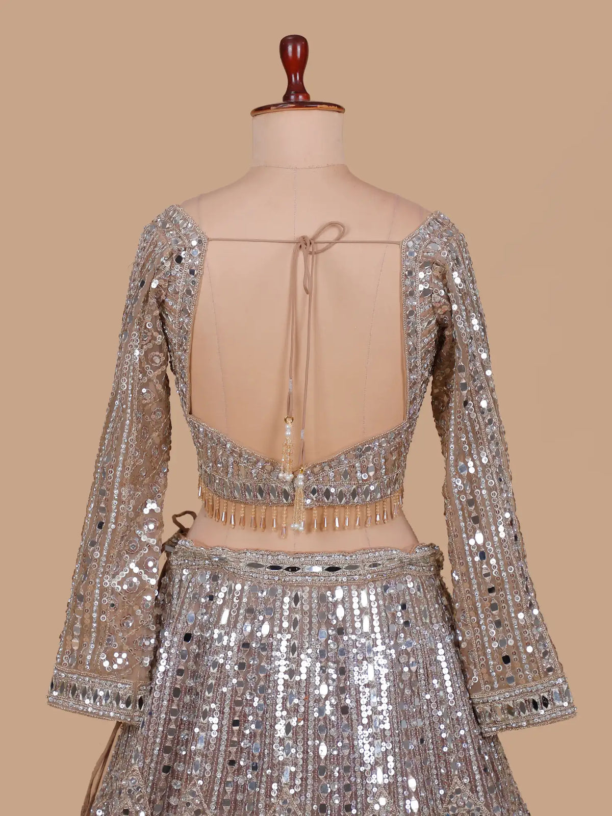 Chickoo Party Wear Lehenga Featuring Full-Length Mirror Diamond Patterns
