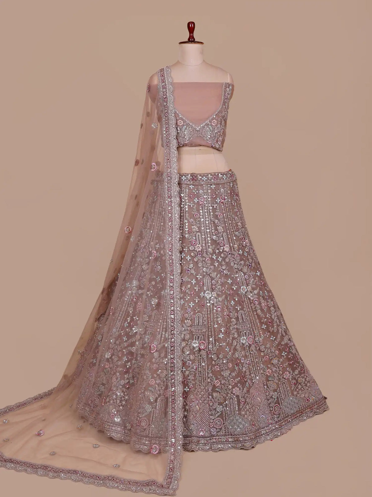 Get Chickoo Net Unstitched Lehenga With Multi Thread Floral Sequin Detailing