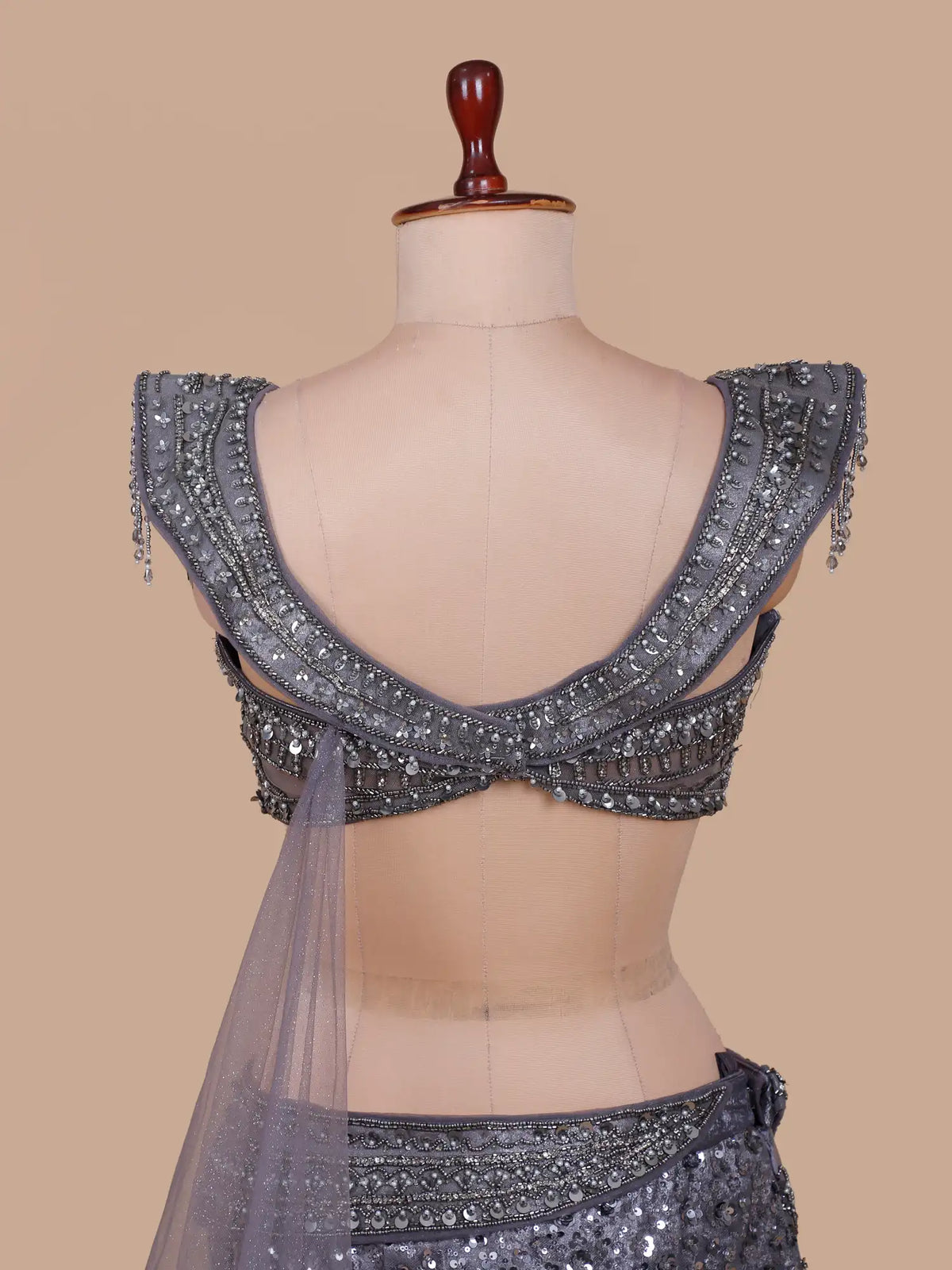 Metallic Grey Mermaid Lehenga Featuring Hip Ruffles and Fringe Tassels