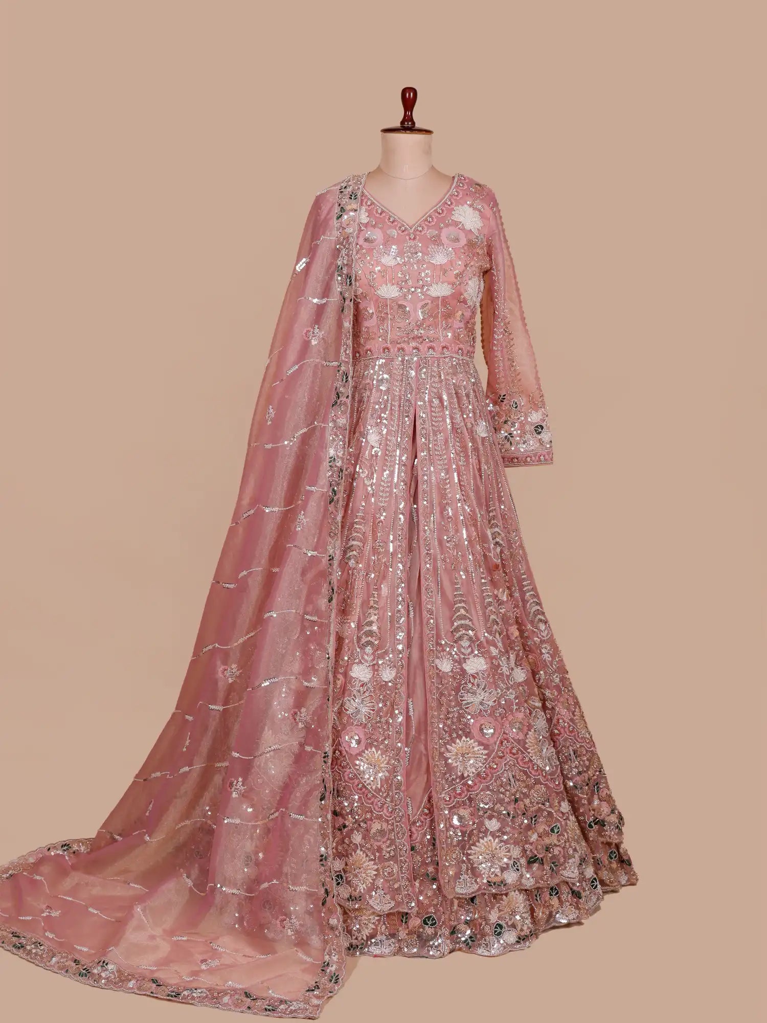 Get Beautiful Dark Peach Organza Long Lehenga With Center Cut Design
