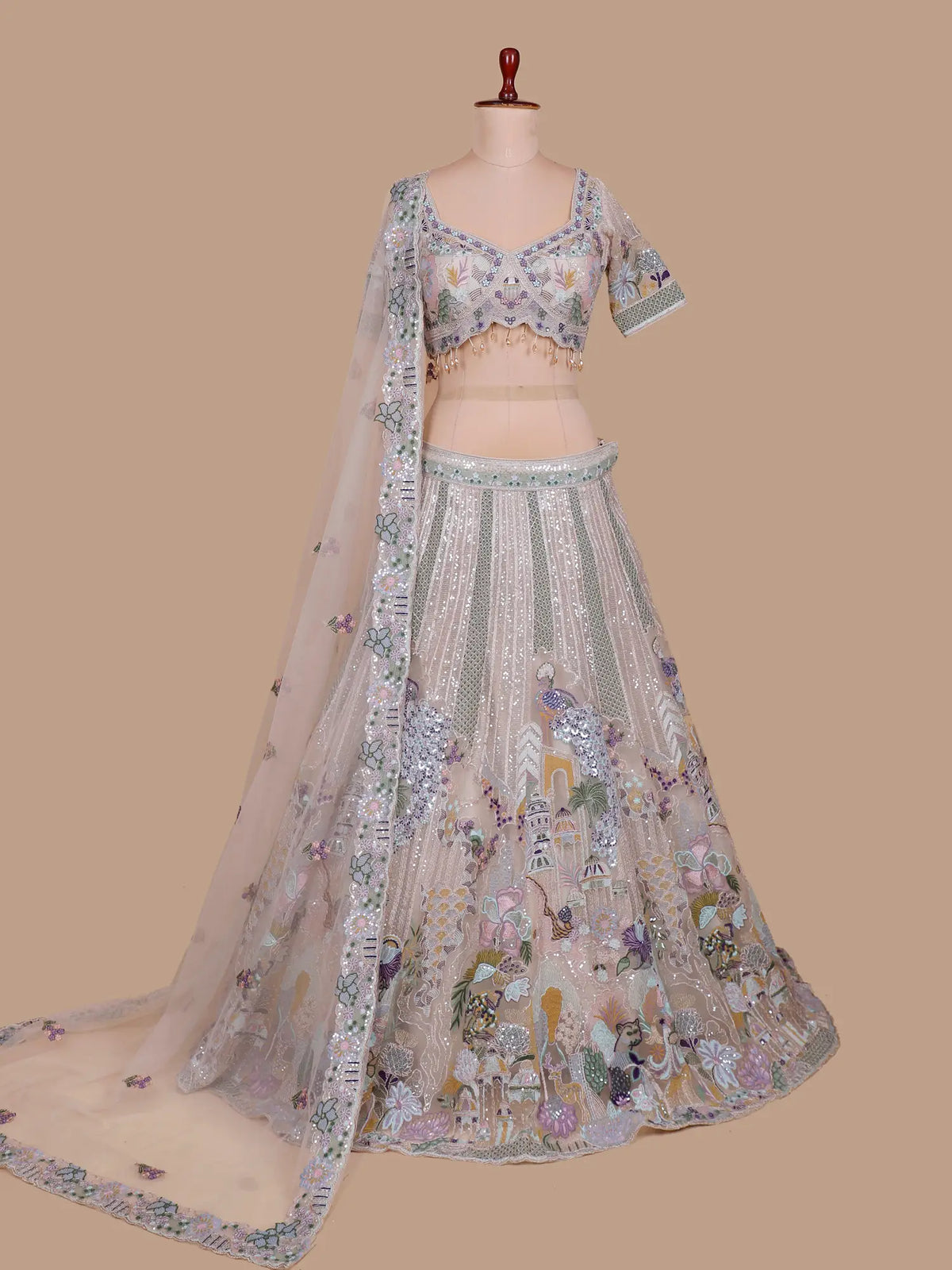 Buy Champagne Gold Net Artistic Lehenga Choli with Bird Floral Embellishment