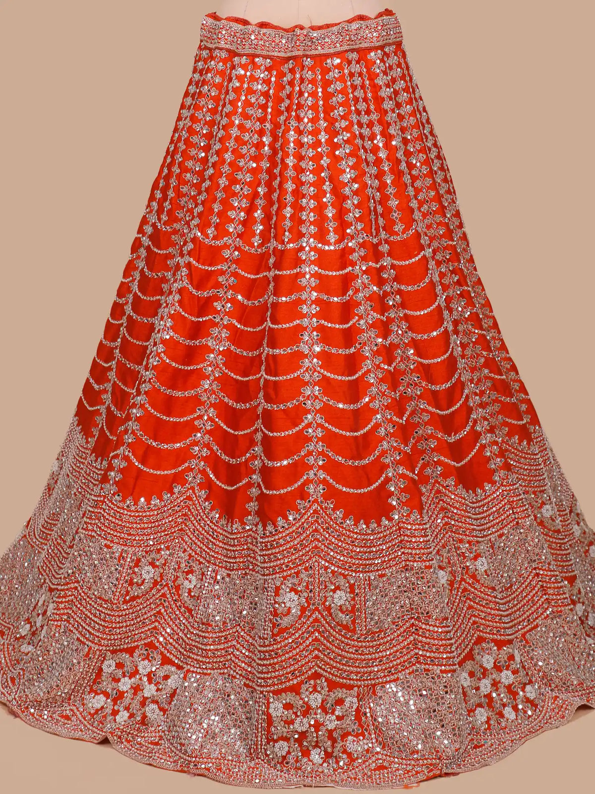 Rust Orange Silk Wedding Lehenga Showcasing Statement Mirror Embroidery