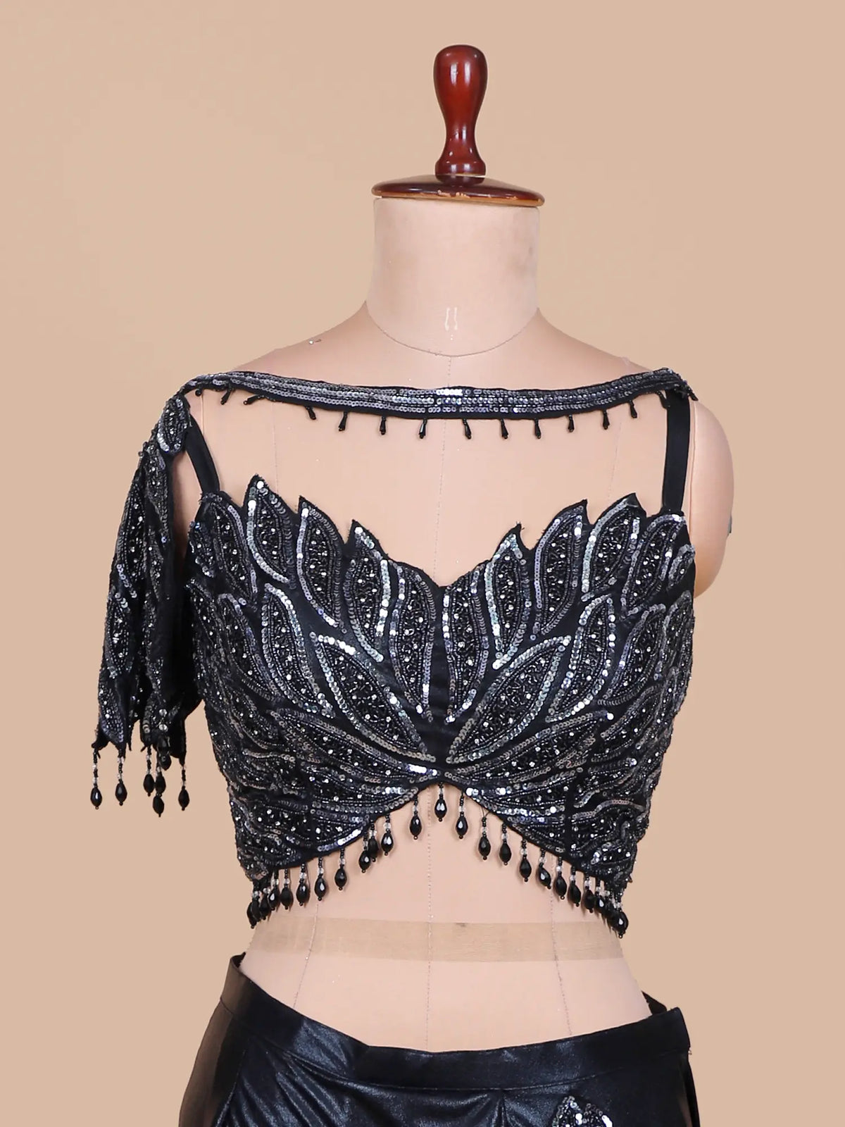 Dazzling Black Pre Draped Saree Featuring Sheer Neck and Sequin Leaf Blouse