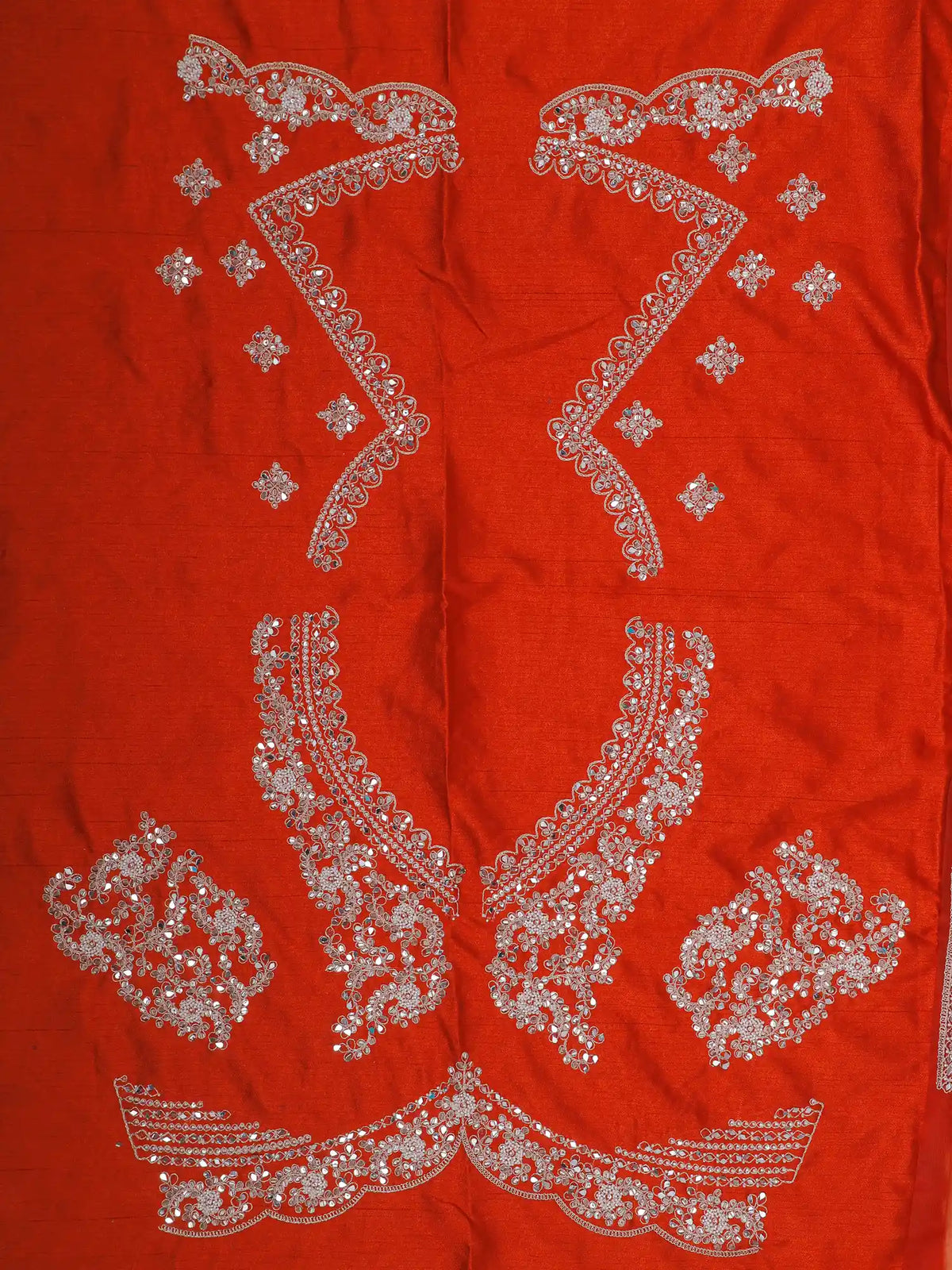 Rust Orange Silk Wedding Lehenga Showcasing Statement Mirror Embroidery