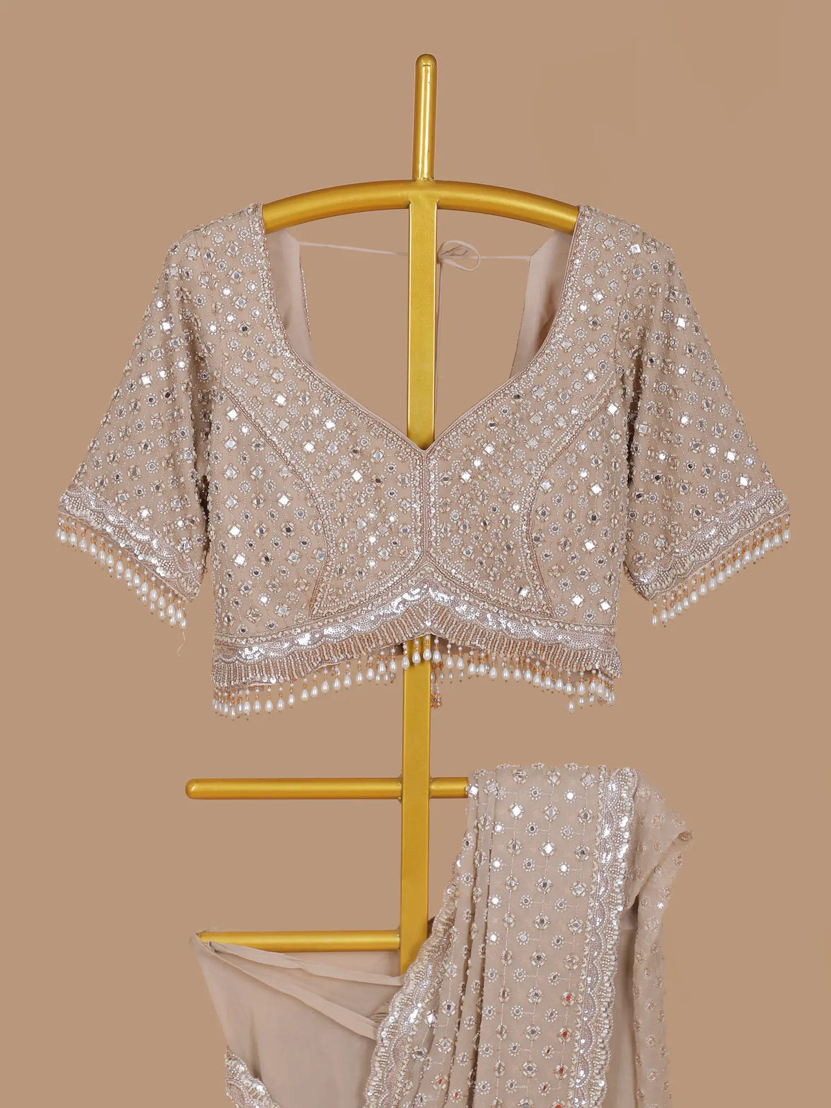 Ivory Party Wear Saree Featuring Mirror Sequins and Pearl Latkans