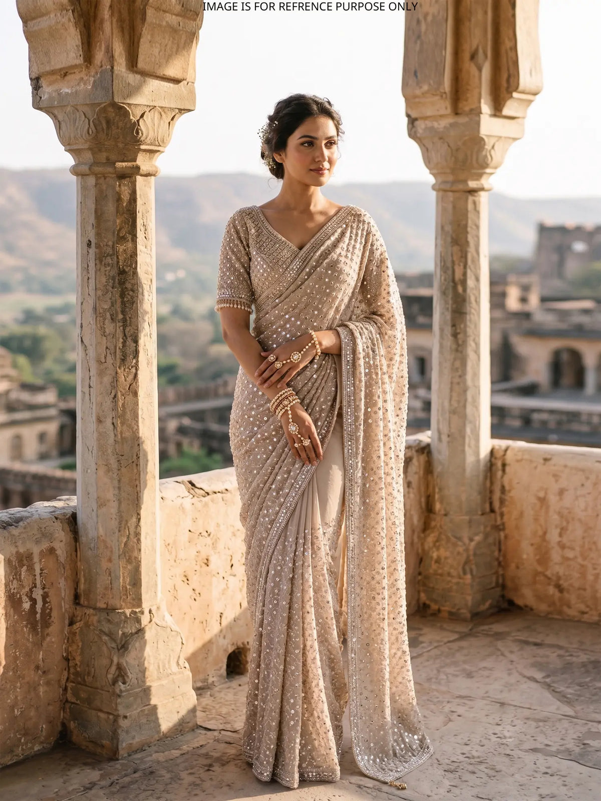 Ivory Party Wear Saree Featuring Mirror Sequins and Pearl Latkans
