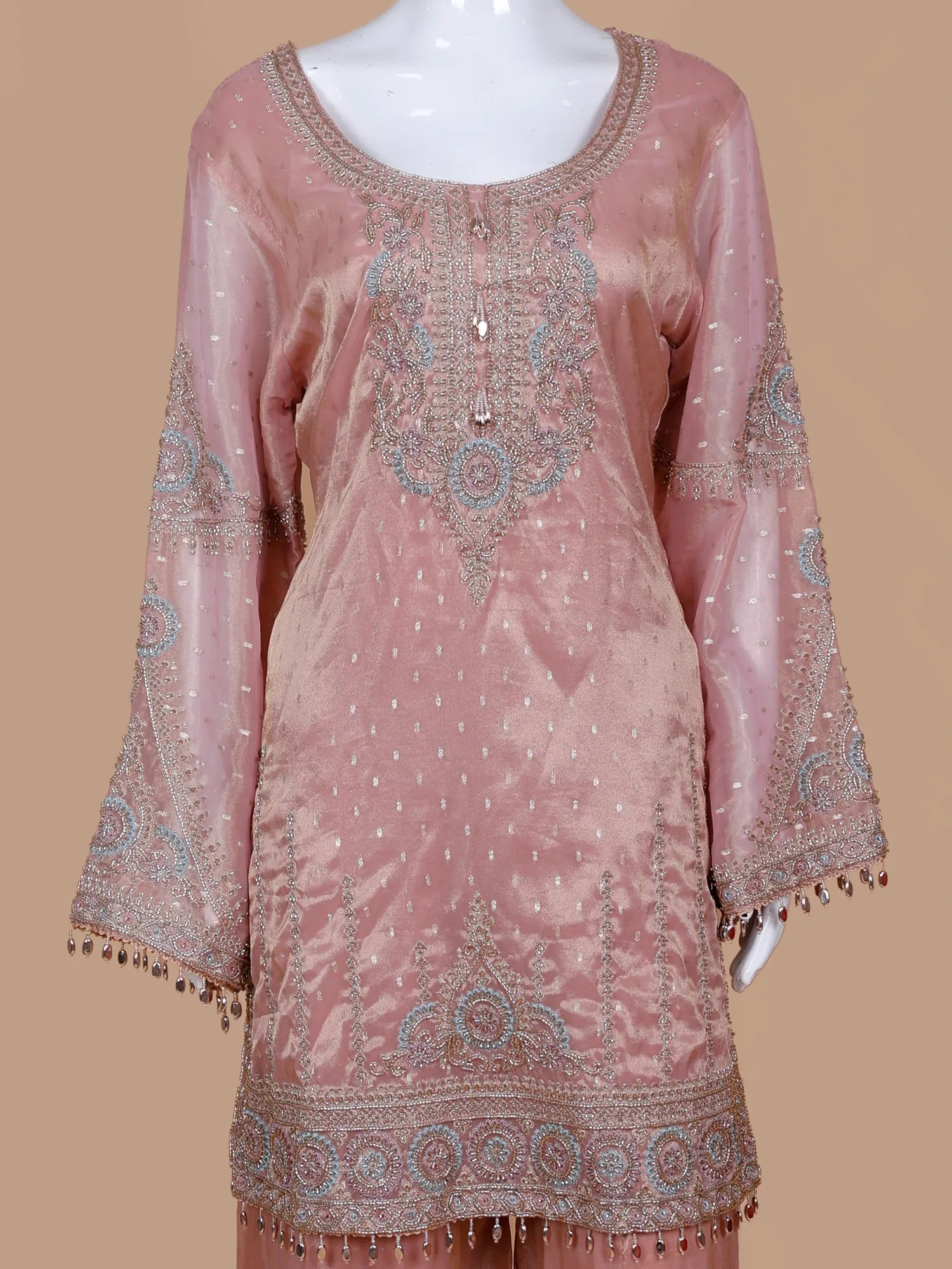 Get Light Peach Silk Traditional Suit Featuring Bead And Threadwork