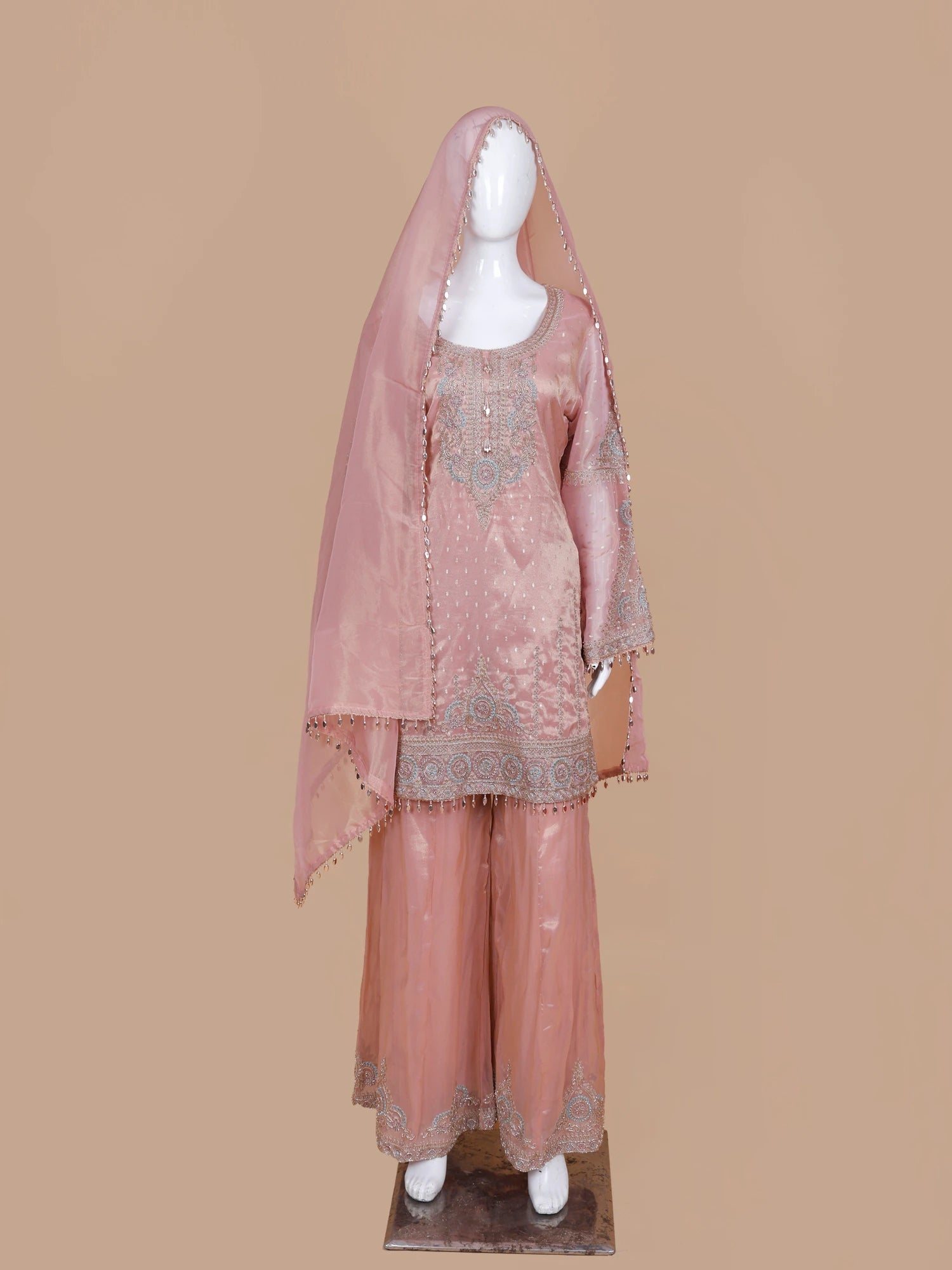 Get Light Peach Silk Traditional Suit Featuring Bead And Threadwork