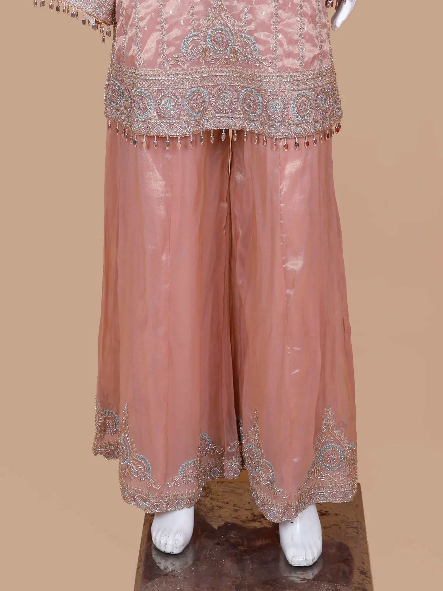 Get Light Peach Silk Traditional Suit Featuring Bead And Threadwork