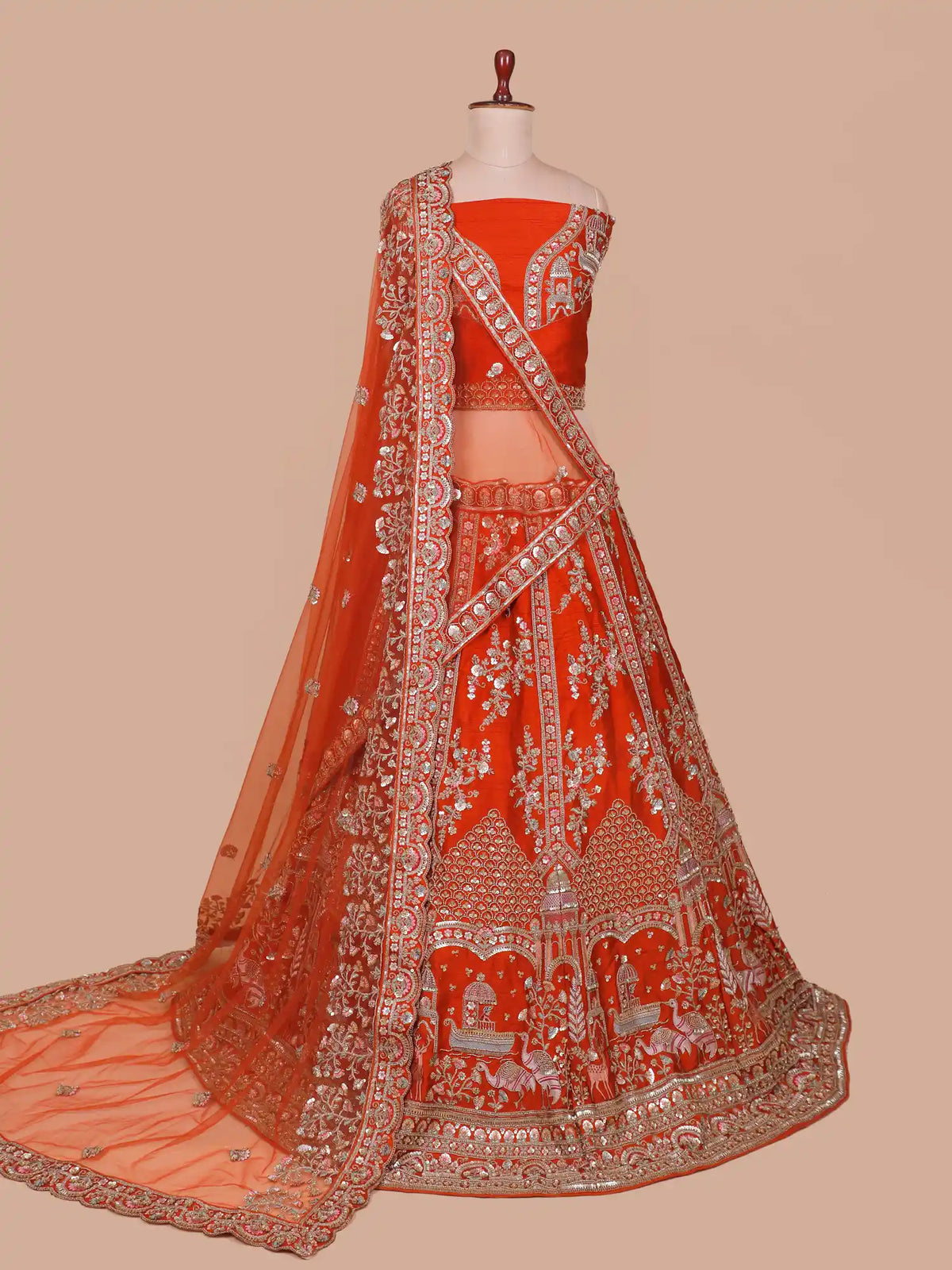 Luxury Rust Orange Bridal Lehenga with Domed Boats and Floral Embroidery