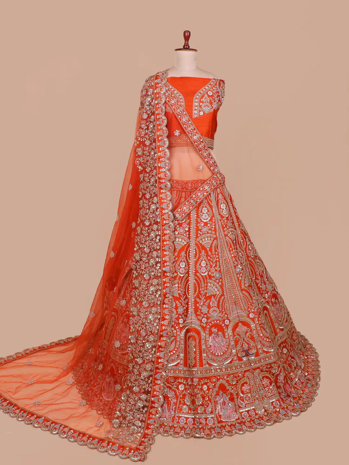 Handcrafted Rust Orange Bridal Lehenga with Wedding Couple Embroidery