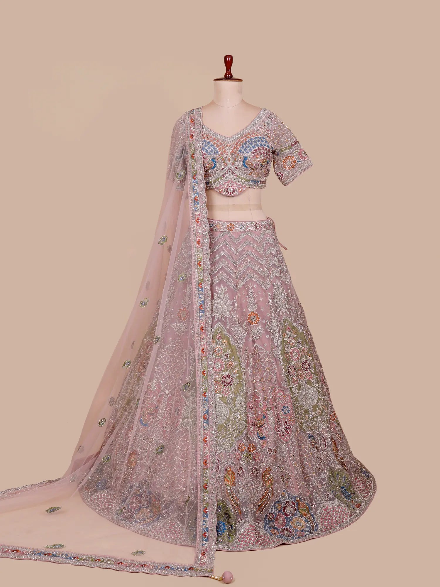 Discover Onion Pink Premium Lehenga Showcasing Artistic Bridal Figure Embroidery