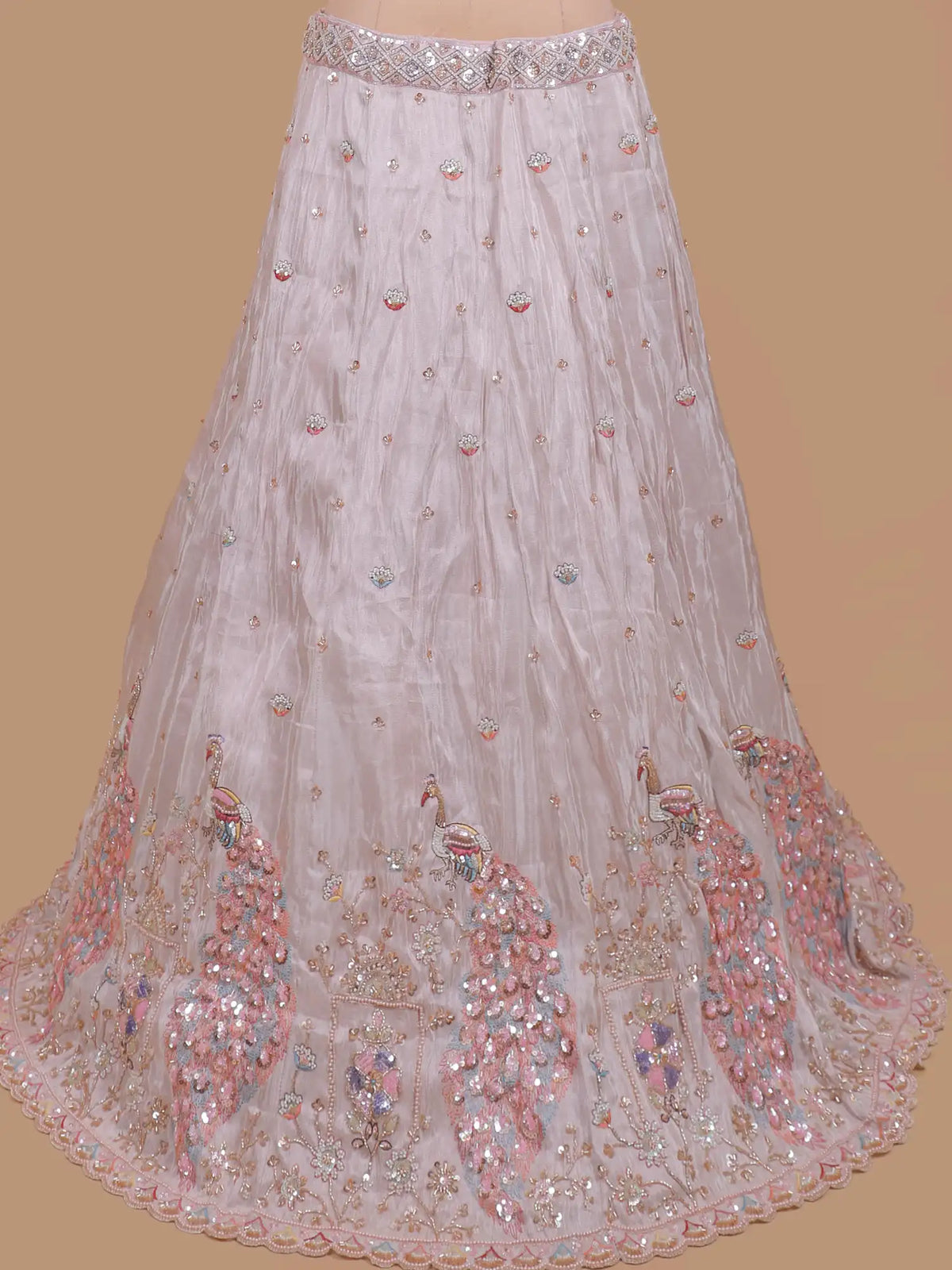 Pastel Pink Shimmer Organza Lehenga Showcasing Peacock Artistry