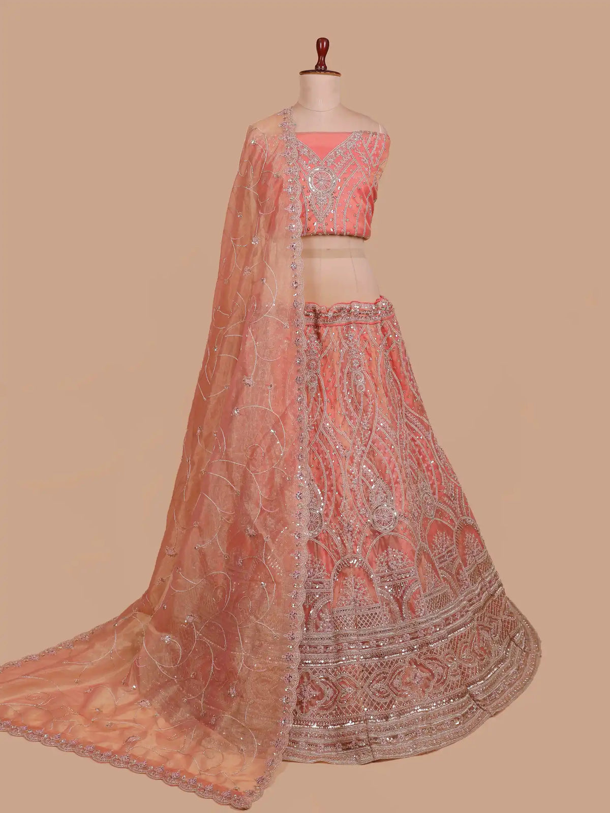 Peach Shimmer Organza Lehenga with Ornate Silver Thread Patterns