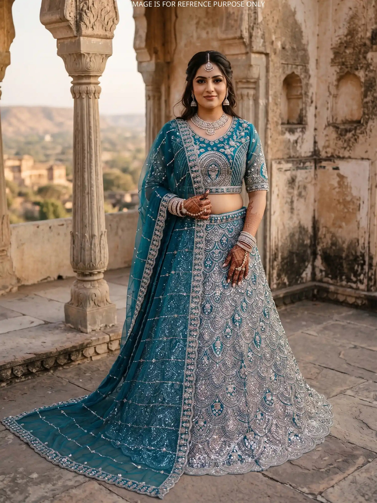 Peacock Blue Net Designer Lehenga Embellished in Metallic Sequin and Bead Detailing