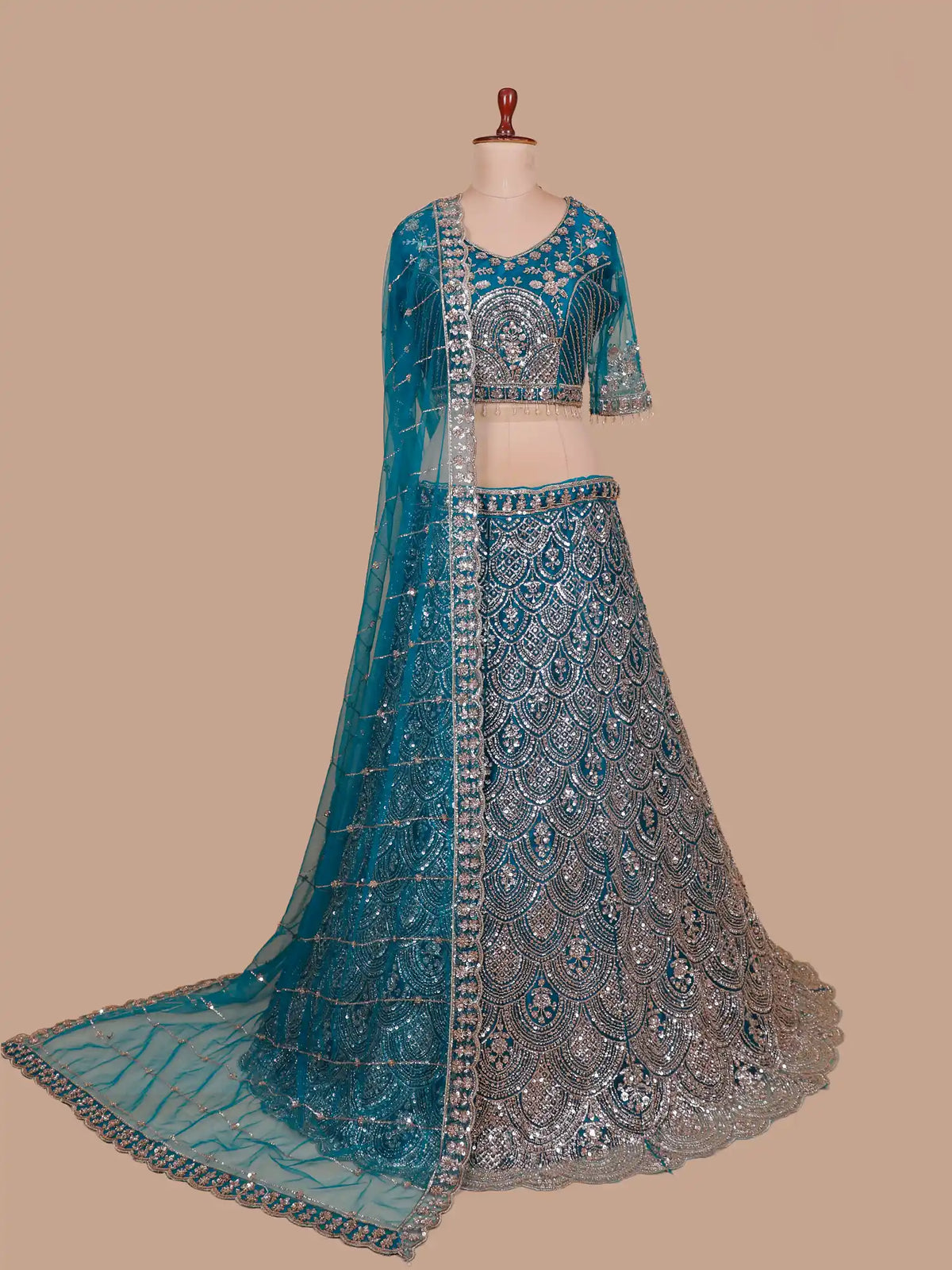 Peacock Blue Net Designer Lehenga Embellished in Metallic Sequin and Bead Detailing