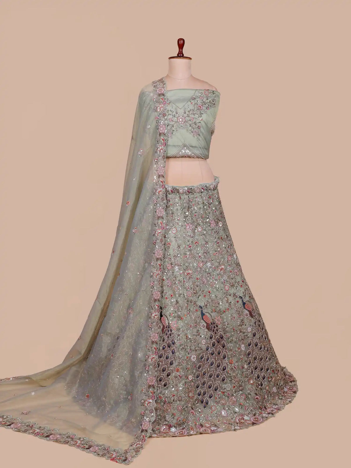 Elegant Pista Green Lehenga with Pink Floral and Navy Peacock Motifs