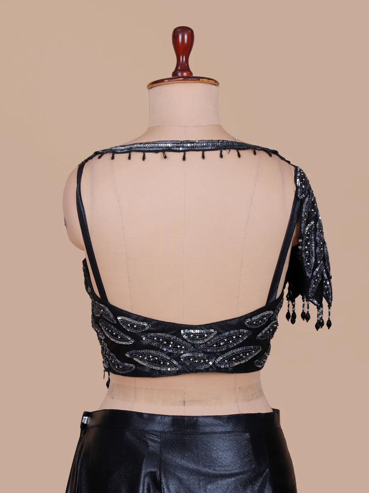 Dazzling Black Pre Draped Saree Featuring Sheer Neck and Sequin Leaf Blouse