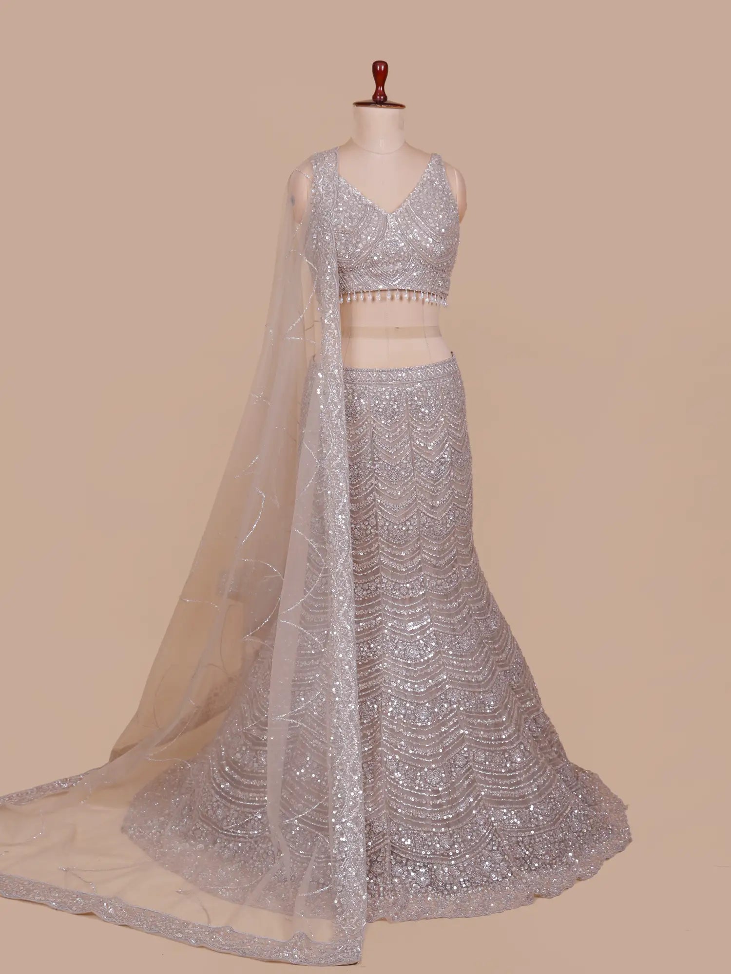 Exclusive Champagne Mermaid Lehenga Choli Adorned With Pearl Moti Work
