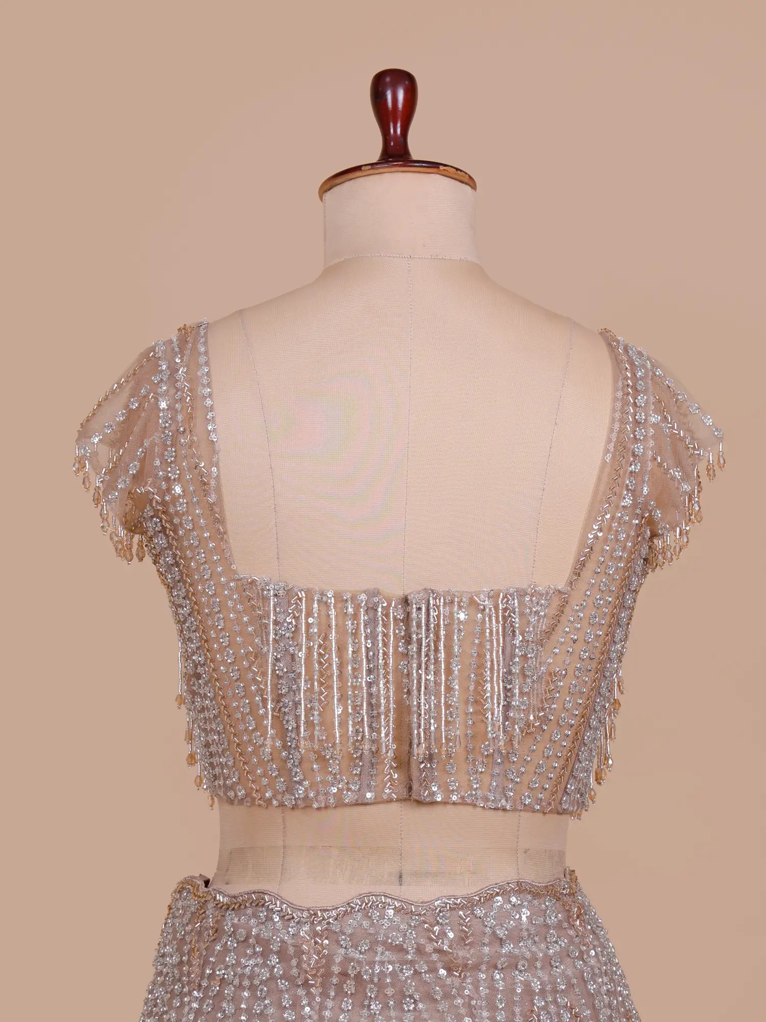 Premium Chickoo Net Designer Mermaid Lehenga Enhanced With Crystal Work