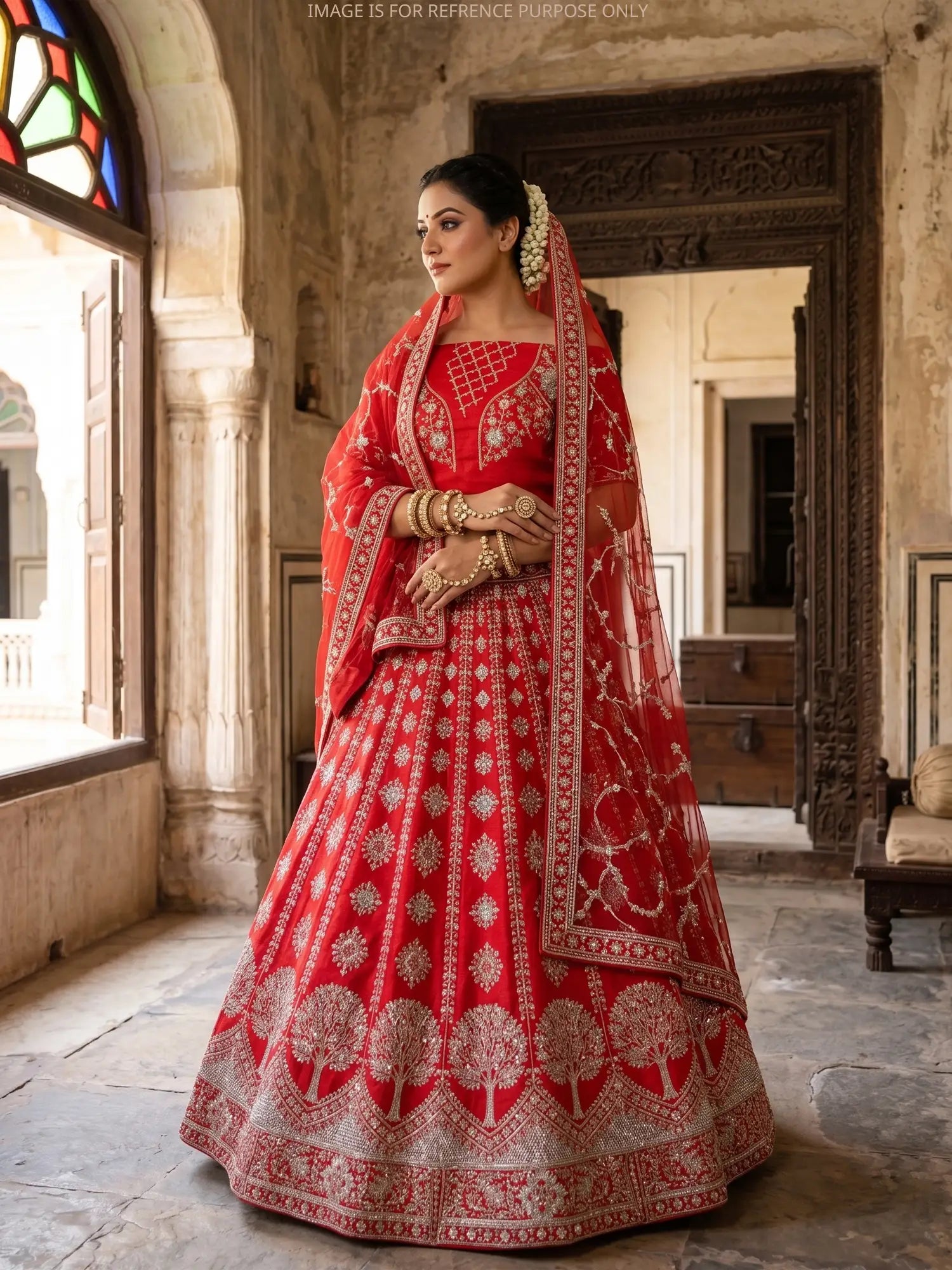 Red Royalty Silk Unstitched Bridal Lehenga Showcasing Tree Embroidery