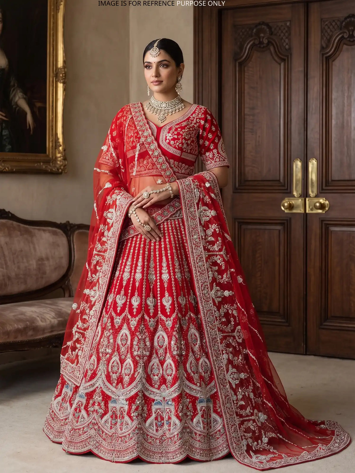 Red Silk Couture Lehenga with Domed Motifs and Intricate Silver Embroidery