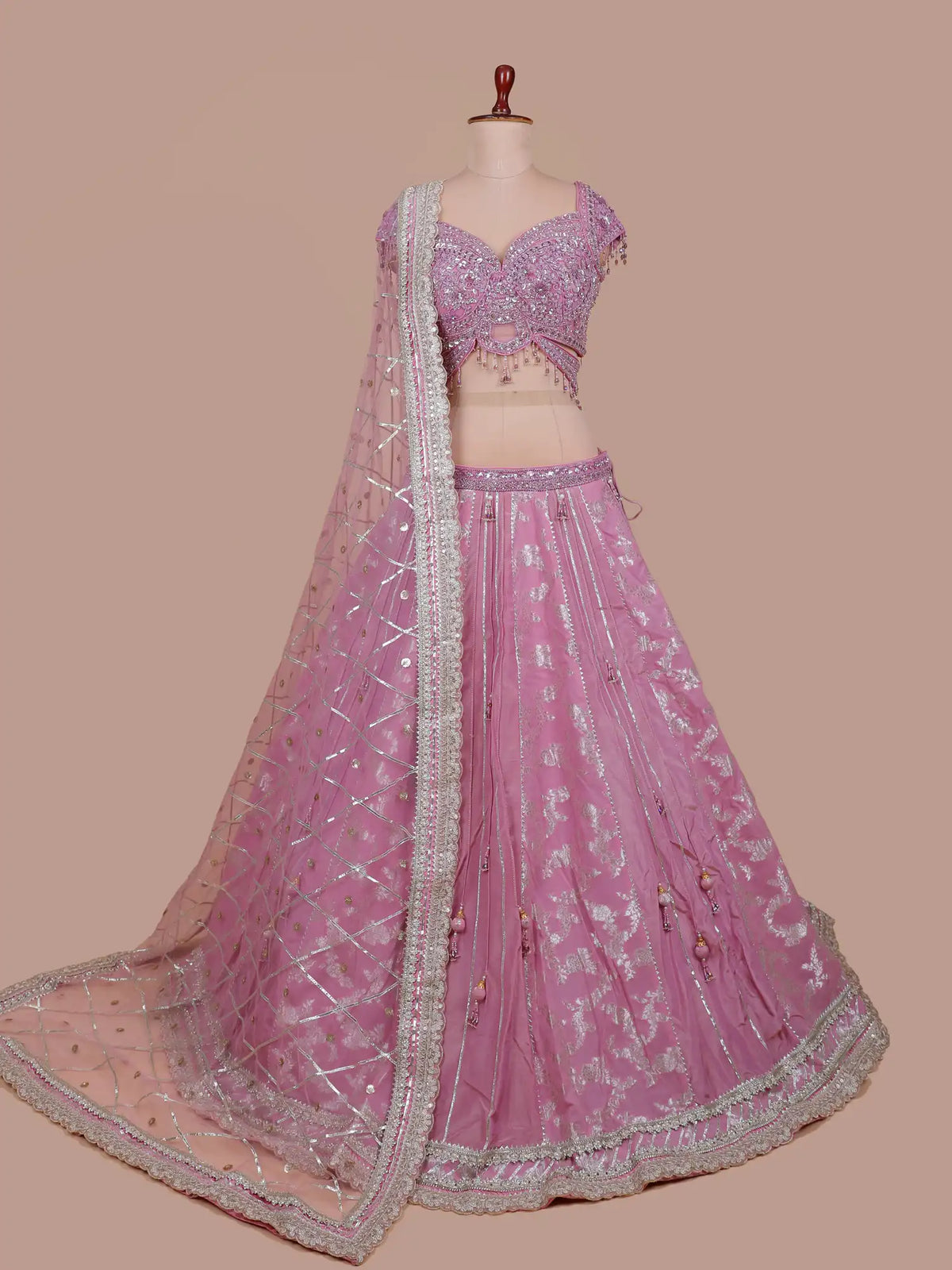 Luxury Pink Silk Lehenga with Statement Cutout Blouse and Crystal Tassels