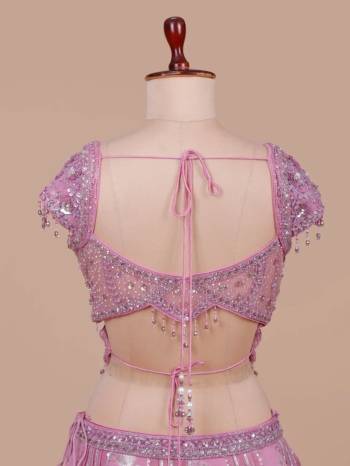 Luxury Pink Silk Lehenga with Statement Cutout Blouse and Crystal Tassels