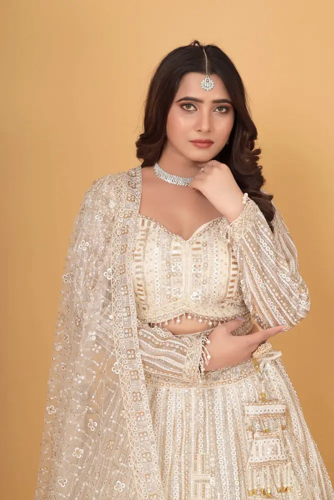 White Bollywood Inspired Net Lehenga With Hand-Pal Work Sequence And Jarkan Details
