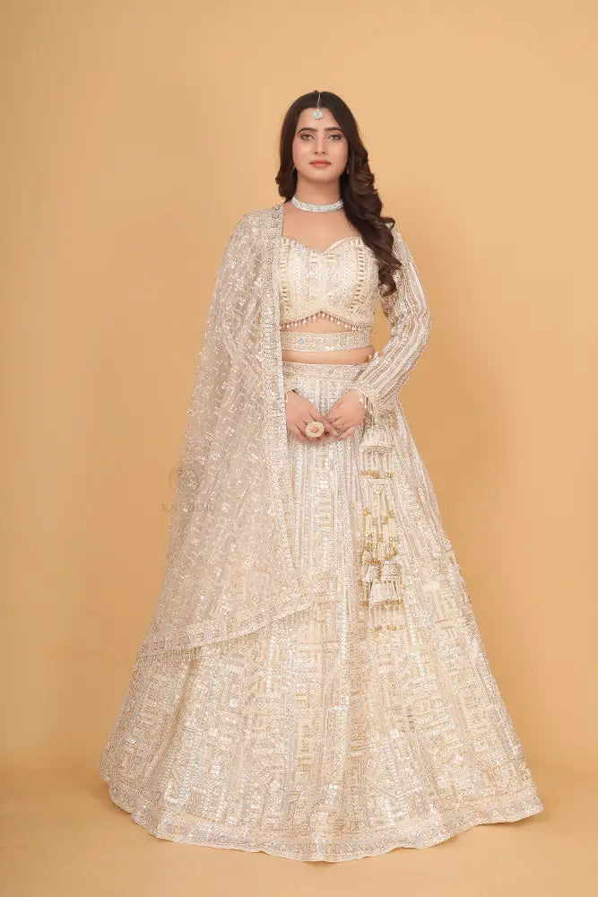 White Bollywood Inspired Net Lehenga With Hand-Pal Work Sequence And Jarkan Details